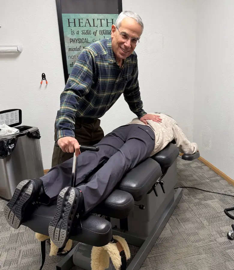 Dr. Siegel performing a gentle drop-table back adjustment