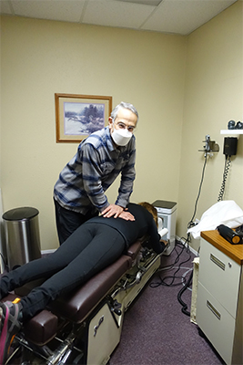 Dr. Siegel treating a patient with back pain in Silverdale, WA
